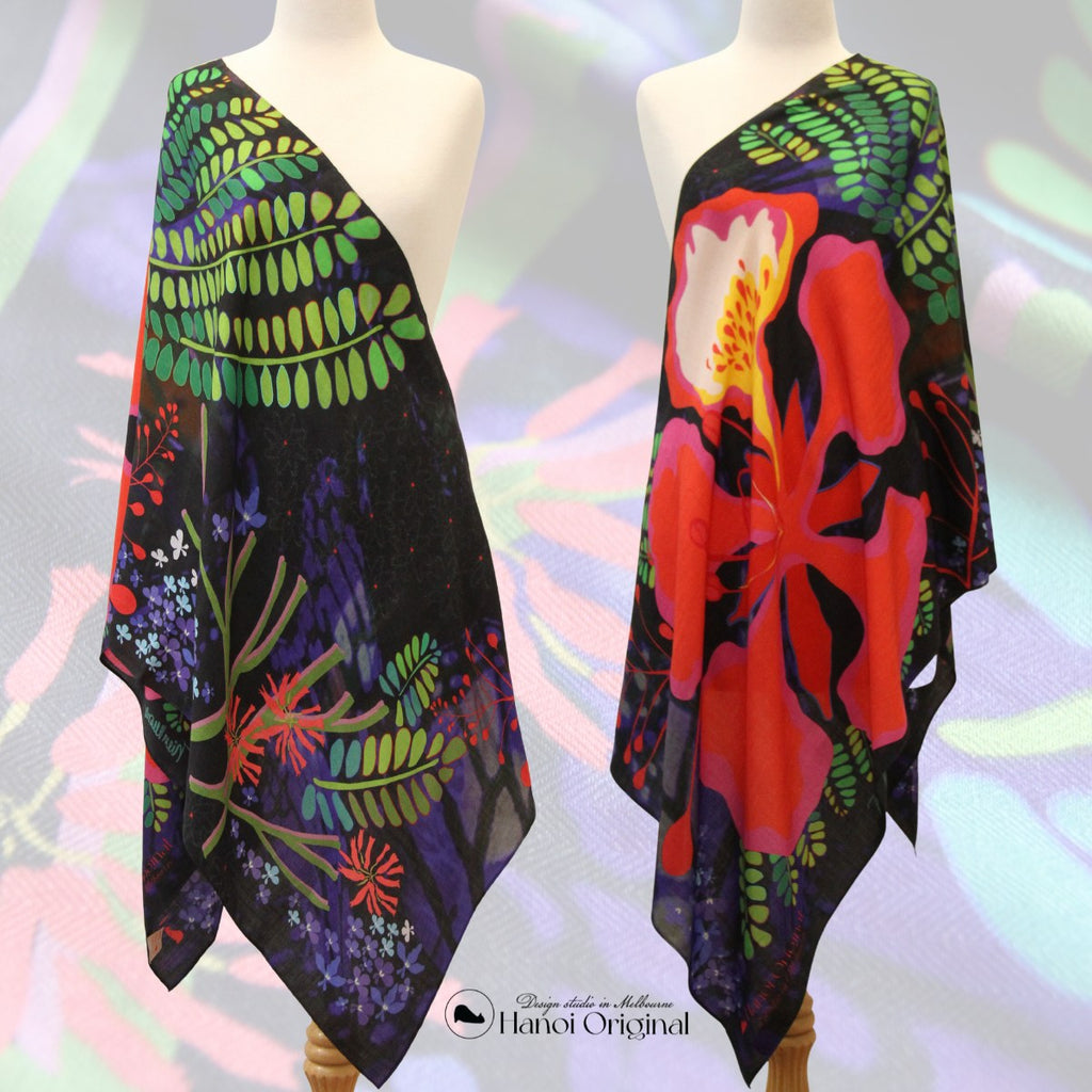 Showing two ways to drape the long scarves, one shows more green and the other more red. The scarf features a big red Royal Flame flower with blue labelio flowers