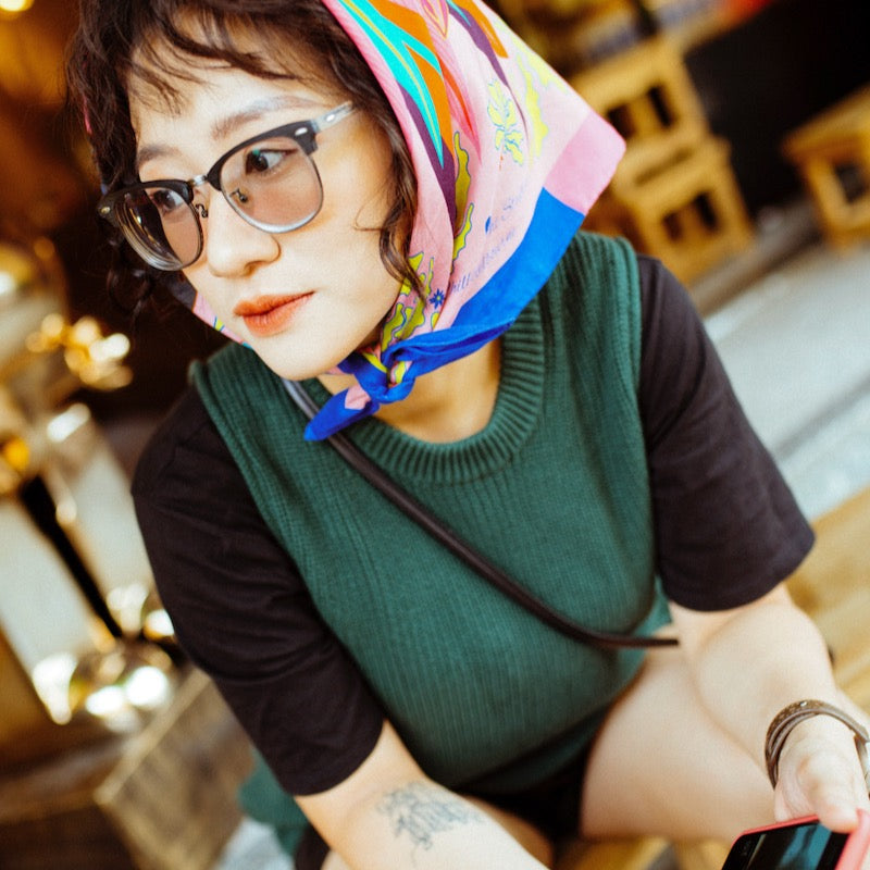 A girl wearing Pink blue border small scarf 65cm by Hanoi Original in Hoi An